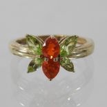 A 9 carat gold Mexican fire opal and peridot ring,