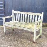 A hardwood slatted garden bench,