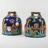 A pair of majolica cheese domes,