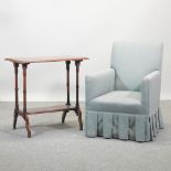 A 1920's green upholstered armchair, together with a reproduction occasional table,