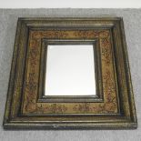 A wooden framed wall mirror, with painted decoration,