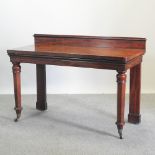 A William IV mahogany serving table, with a gallery back, on hexagonal legs,