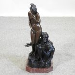 An Eastern style bronze figure group, of a man and a lady,
