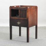 A George III mahogany bedside cabinet, with a tambour front,