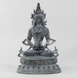 A reproduction cast iron model of a Buddha, seated,