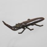 A reproduction bronze model of a locust,