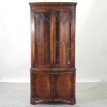 A Bevan Funnel reproduction mahogany standing corner cupboard,