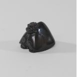 A Chinese bronze paperweight, in the form of a dog,