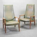 A pair of 1970's style green upholstered high back armchairs