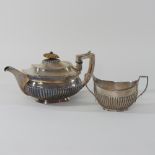 A George III half gadrooned silver teapot, maker RH, London 1789, 14cm high,