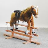 A modern rocking horse, on stand,