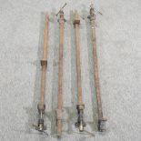 A collection of four sash clamps