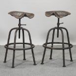 A vintage style metal adjustable tractor seat stool,