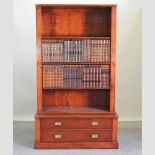 A good quality reproduction television cabinet, in the form of a campaign style bookcase,