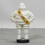 A cast iron figure of the Michelin man,