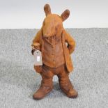 A rusted cast iron figure of Mr Ratty,