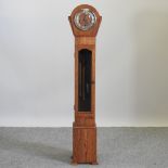 An early 20th century oak cased grandmother clock,