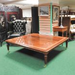 An unusually large Regency style mahogany and inlaid coffee table, on castors,