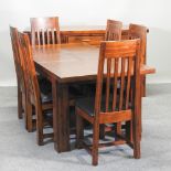 A hardwood extending dining table, with one additional leaf, 180 x 90cm overall,