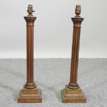 A pair of early 20th century brass column table lamp bases,