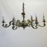 A pair of large brass six branch chandeliers,