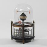 A modern automaton style clock, in the form of fish, under a glass dome,