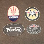 A reproduction painted metal Maserati sign, together with an AJS sign, a Triumph plaque,