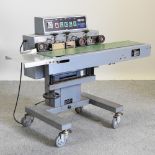 A Showy industrial electric band sealer,