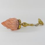 An Arts and Crafts brass pendant ceiling light, RD 539937, with an opaque pink glass flame shade,