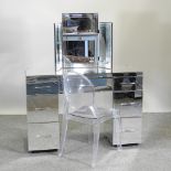 A mirrored dressing table, 120cm, together with a perspex 'Ghost' chair,