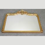 An ornate gilt framed overmantel mirror,