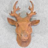 A rusted cast iron deer's head,