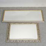 A silver painted framed wall mirror,