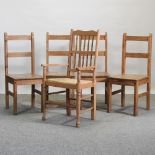A set of four pine dining chairs,