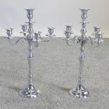 A pair of plated table candelabra,