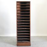 An early 20th century style stained pine filing bookcase, 53cm wide,