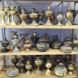 A collection of approximately forty-five oil lamp bases