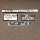 A reproduction station master sign, together with a railway notice sign, a railway sign,