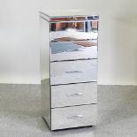 A mirrored narrow chest,