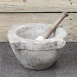 A large marble pestle and mortar,