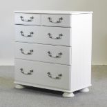 A white painted chest of drawers,