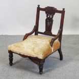 A Victorian yellow upholstered nursing chair