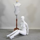 A seated female mannequin, together with a dressmaker's dummy,