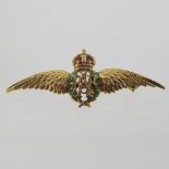 An enamelled 14 carat gold Royal Air Force brooch, in the form of a coronet and wings, 4cm wide,