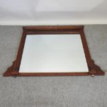 An Edwardian mahogany over mantel mirror,