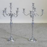 A pair of plated table candelabra,