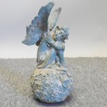 A cast iron figure of an angel,