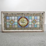 An early 20th century stained glass window panel,