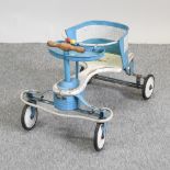 A vintage blue painted metal child's tricycle,