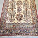 A Persian woollen carpet,